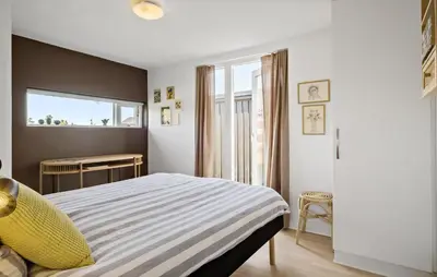 a bedroom with a bed and a window at Gorgeous Home In Brovst With Sauna in Brovst