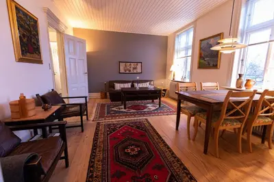 a living room with a table and a couch at Lejlighed i Holstebro gågade in Holstebro