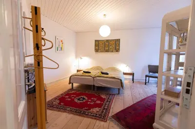 a bedroom with a bed in a room at Lejlighed i Holstebro gågade in Holstebro