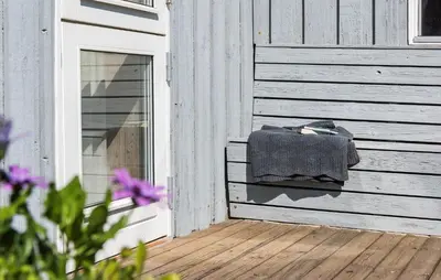 a blanket is sitting on the side of a building at Stunning Home In Blokhus With Wifi in Blokhus