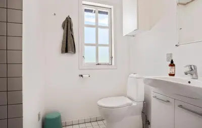 a white bathroom with a toilet and a sink at Beautiful Home In Fur With Wifi in Fur
