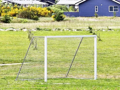 a soccer goal in the middle of a field at 4 star holiday home in Brovst in Brovst