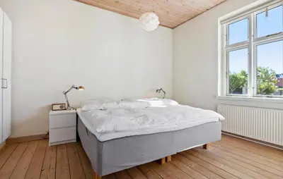 a white bedroom with a bed and a window at Nice Home In Løgstør With Wifi in Løgstør