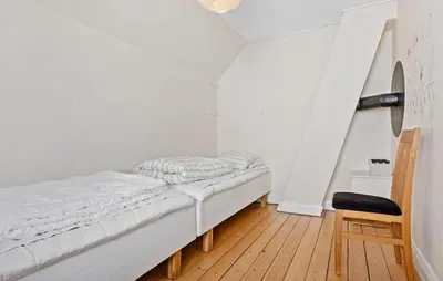 a bed in a room with a wooden floor at Nice Home In Løgstør With Wifi in Løgstør