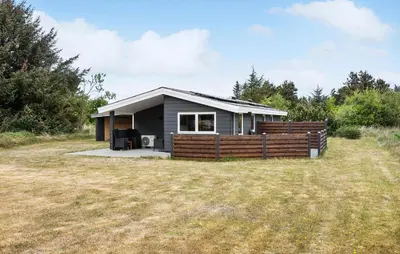 a small house with a fence and a yard at 3 Bedroom Beautiful Home In Thisted in Thisted