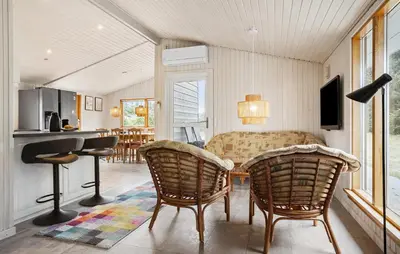 a living room with chairs and a table at 3 Bedroom Beautiful Home In Thisted in Thisted
