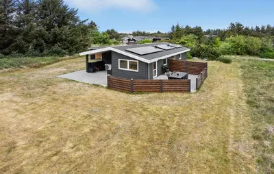 a tiny house with a solarium on a field at 3 Bedroom Beautiful Home In Thisted in Thisted
