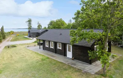an image of a black cabin with a yard at 3 Bedroom Cozy Home In Højslev in Højslev