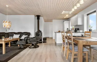 a kitchen and dining room with a wood stove at 3 Bedroom Cozy Home In Højslev in Højslev