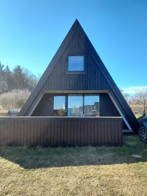 a house with a gambrel roof at Holiday home golf house in beautiful Himmerland Farsø in Farsø