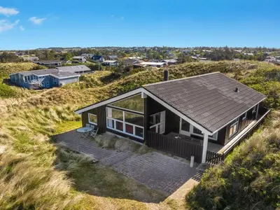 an aerial view of a house on a beach at Holiday Home Elni - 350m from the sea by Interhome in Blokhus