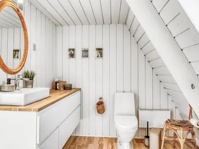a white bathroom with a sink and a toilet at Apartment Kauno - 16km to the fjord by Interhome in Farsø