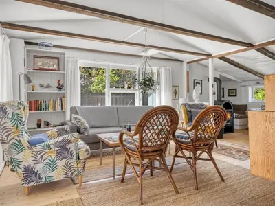 a living room with chairs and a couch at Holiday Home Rieke - 2km from the sea by Interhome in Blokhus