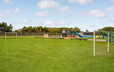 a park with a playground with a goal at 5 Bedroom Awesome Home In Vestervig in Vestervig
