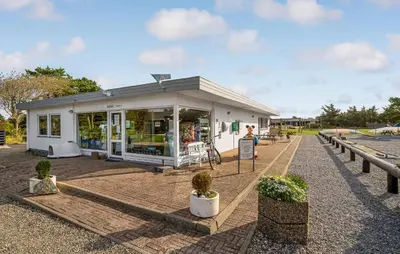 a small white building with plants in front of it at 5 Bedroom Awesome Home In Vestervig in Vestervig