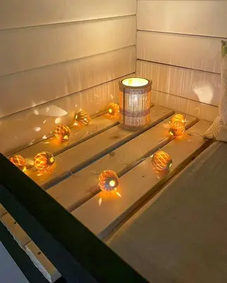a bathtub with orange balls in it with a candle at Traditional Summer House Near Blokhus Beach in Blokhus