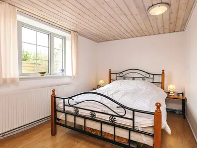 a bedroom with a bed and a window at 6 person holiday home in Vestervig in Vestervig