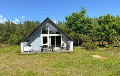 a small house with a picnic table on a field at 3 Bedroom Cozy Home In Fur in Furland