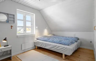 a bedroom with a bed and a window at Gorgeous Home In Vestervig With Wifi in Vestervig