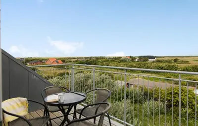 a balcony with chairs and a table with a view at 3 Bedroom Amazing Home In Harboøre in Harboør