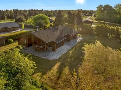an overhead view of a house with a large deck at Well-Maintained Log House With Hot Tub, Sauna And Covered Terrace In Thy