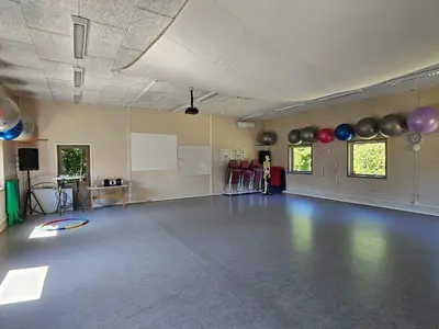 a room with a dance floor with balloons on the wall at Cozy Danish Room for Solo Stays in Lemvig