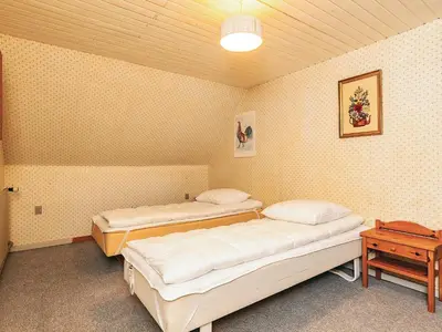 a room with two beds in a room at 10 person holiday home in Spøttrup in Spottrup