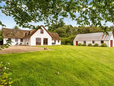 an image of a farm house with a large yard at Holiday Home Åsta - 400m to the fjord by Interhome in Roslev