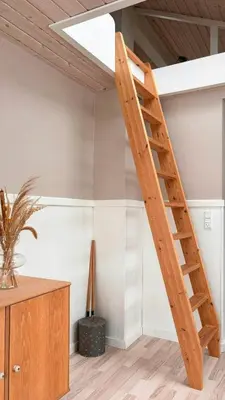 a wooden staircase in a room with a ceiling at Beautiful Home Near Løkken On Secluded Plot in Løkken
