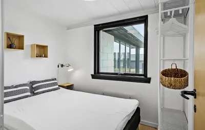 a bedroom with a bed and a window at 3 Bedroom Nice Home In Harboøre in Harboør