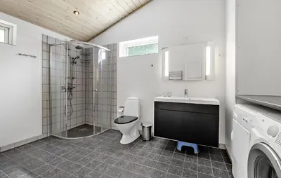a bathroom with a toilet and a shower and a sink at Awesome Home In Løgstør With Wifi in Løgstør