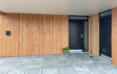 a building with a potted plant on the side of it at Cozy Home In Vestervig With Sauna in Vestervig