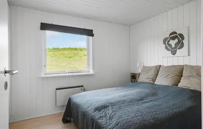 a bedroom with a bed and a window at Gorgeous Home In Lemvig in Lemvig