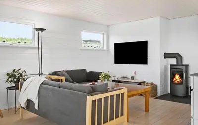 a living room with a couch and a fireplace at Gorgeous Home In Lemvig in Lemvig