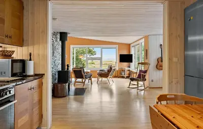 a kitchen and living room with chairs and a table at Stunning Home In Hurup Thy With Wifi in Sønder Ydby