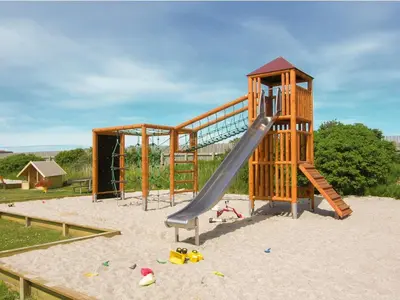 a playground with a slide in the sand at 4 star holiday home in Thyborøn in Thyborøn