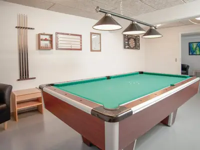 a pool table in a living room with afits at 5 star holiday home in Thyborøn in Thyborøn