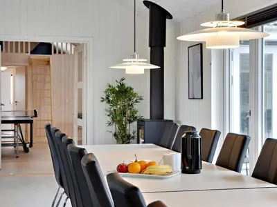 a dining room with a table with a plate of fruit on it at 5 star holiday home in Spøttrup in Spottrup