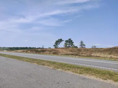 an empty road in the middle of a field at 5 star holiday home in Farsø in Farsø