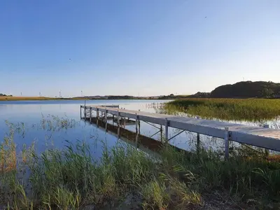 a dock in the middle of a body of water at 5 star holiday home in Farsø in Farsø