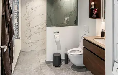 a bathroom with a toilet and a sink at Cozy Apartment In Blokhus With Wifi in Blokhus