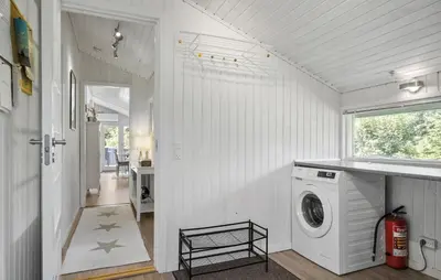 a white laundry room with a washer and dryer at 3 Bedroom Nice Home In Fjerritslev in Fjerritslev