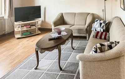 a living room with a coffee table and a tv at Amazing Home In Harboøre With Wifi in Harboør