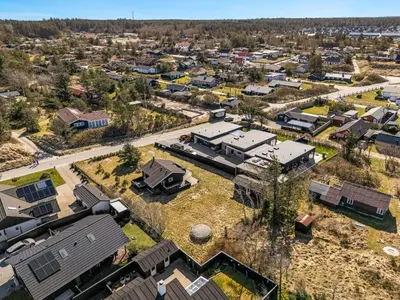 an aerial view of a suburb with houses at Pirupshvarrevej 5A in Blokhus