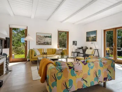 a living room with a couch and a table at Holiday Home Ola - 900m from the sea by Interhome in Bedsted Thy