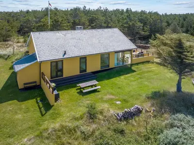 an overhead view of a yellow house with a yard at Holiday Home Ola - 900m from the sea by Interhome in Bedsted Thy