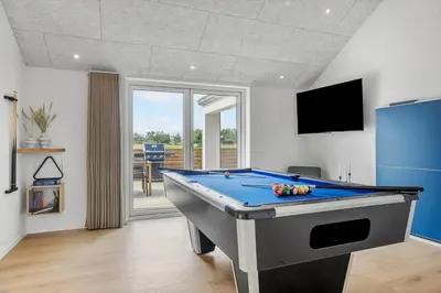 a pool table in a living room with a tv at 871-Thisted-Smedevej-3-A in Thisted