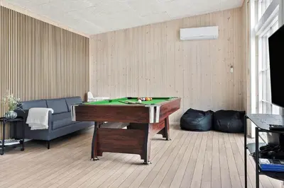 a living room with a pool table and a couch at 158-Thisted-Lyngbakken-8 in Thisted
