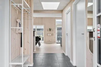 a hallway of a home with a staircase and wooden walls at 158-Thisted-Lyngbakken-8 in Thisted
