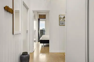 a hallway with a room with a bed and a vase at 1314-Thisted-Lyngbakken-14 in Thisted